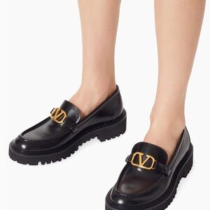 Saks Fifth Avenue Black Leather Loafers with Gold Logo Accent